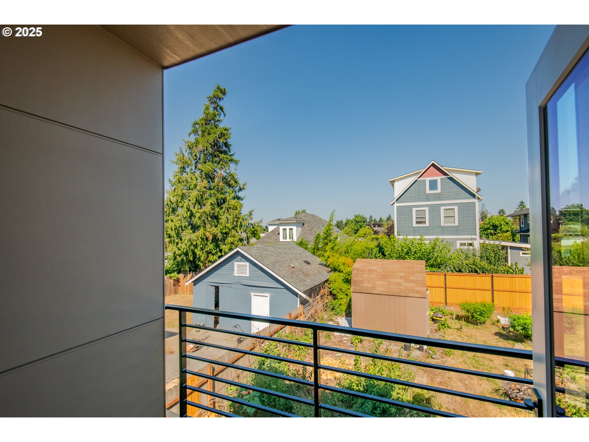6802 Northeast 6th Avenue Portland, OR 97211 - Photo 17 of 23 a view of a house with a street from a balcony