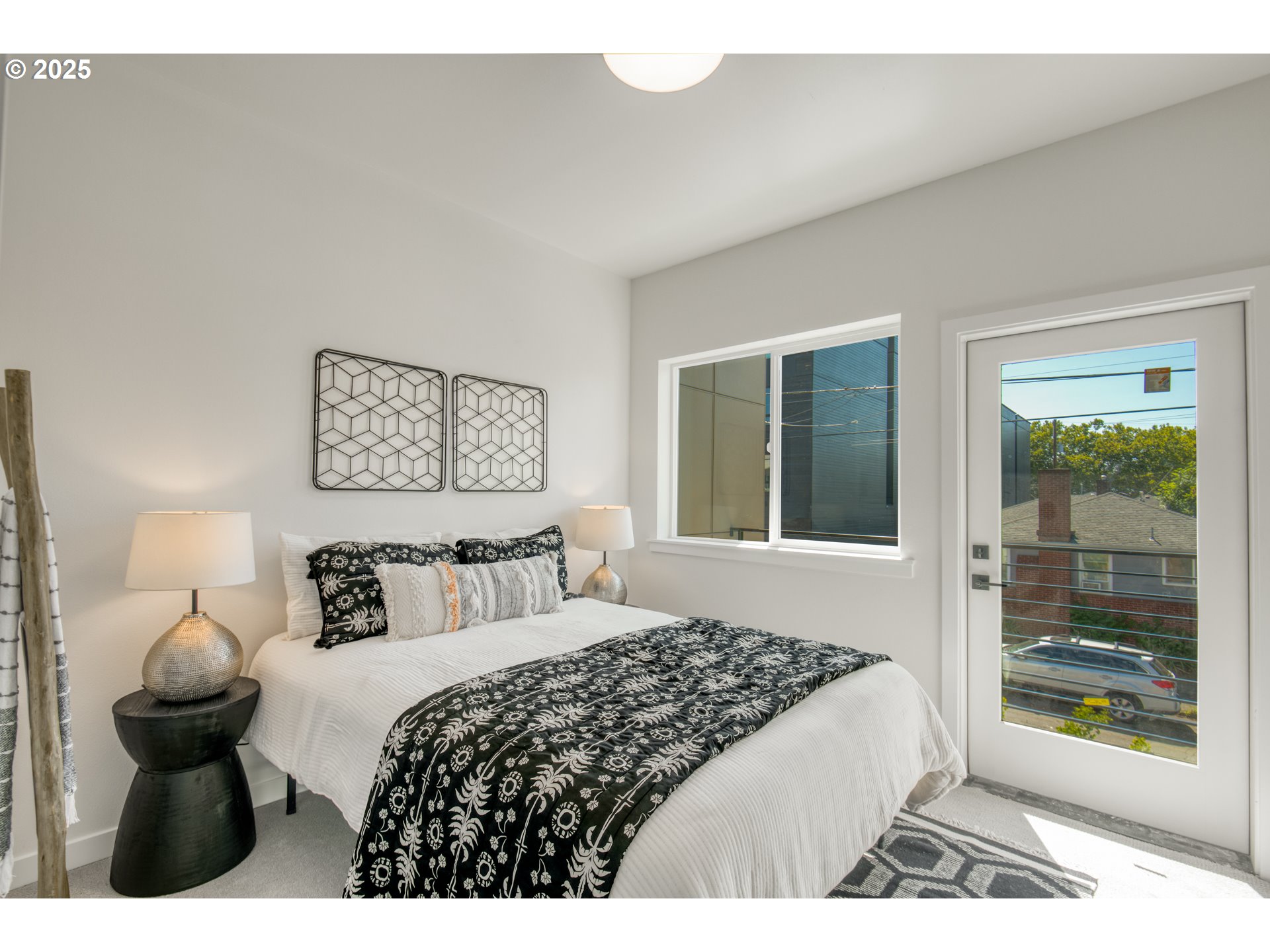 6802 Northeast 6th Avenue Portland, OR 97211 - Photo 10 of 23 a bedroom with a bed and a large window
