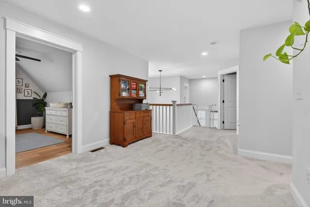 a bedroom with a bed and a table