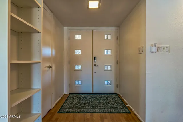 a view of a brick house with a large window