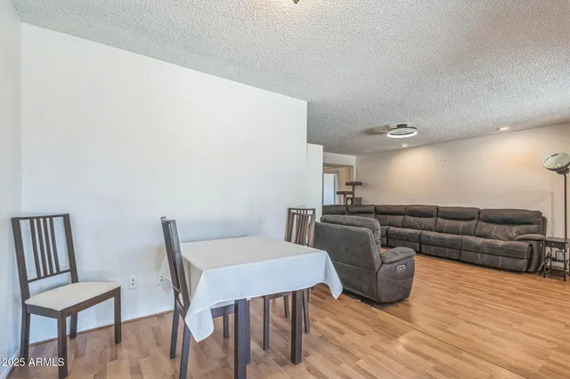 a view of a livingroom with furniture and wooden floor