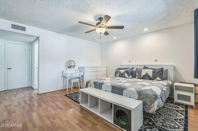 a bedroom with furniture and a window