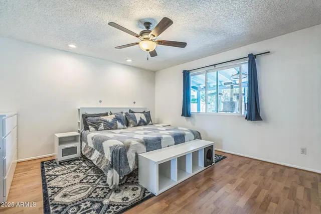 a bed room with bed and window