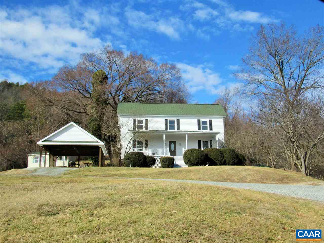 188 Dyson Road Amherst, VA 24521 - Photo 1 of 43 a front view of a house with a garden and trees