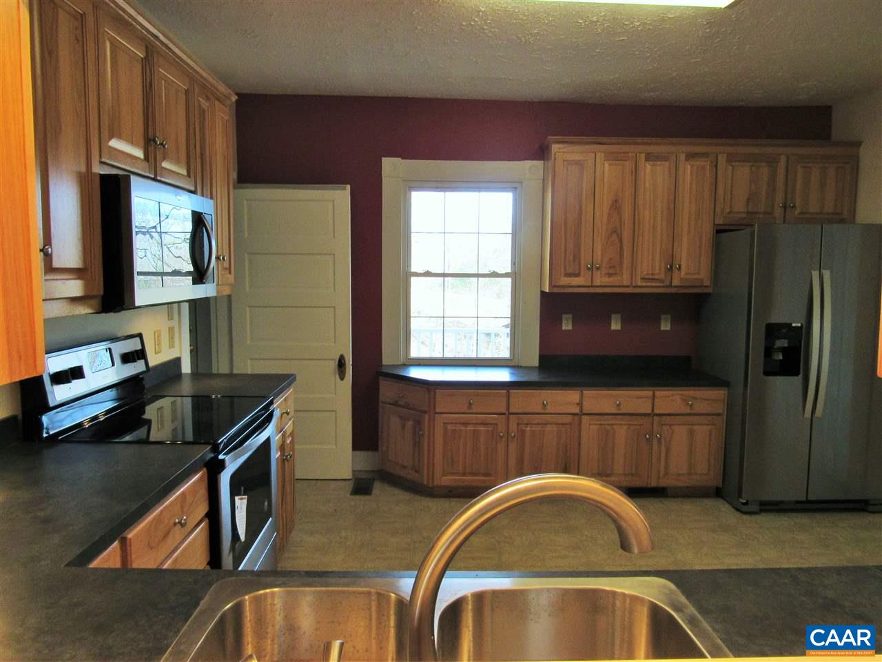 188 Dyson Road Amherst, VA 24521 - Photo 16 of 43 a kitchen with stainless steel appliances granite countertop a sink stove and refrigerator