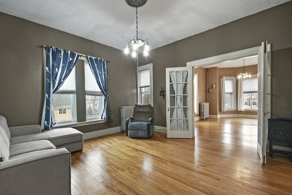 20 West Street, Unit 2 Worcester, MA 01609 - Photo 8 of 18 a living room with furniture and a large window