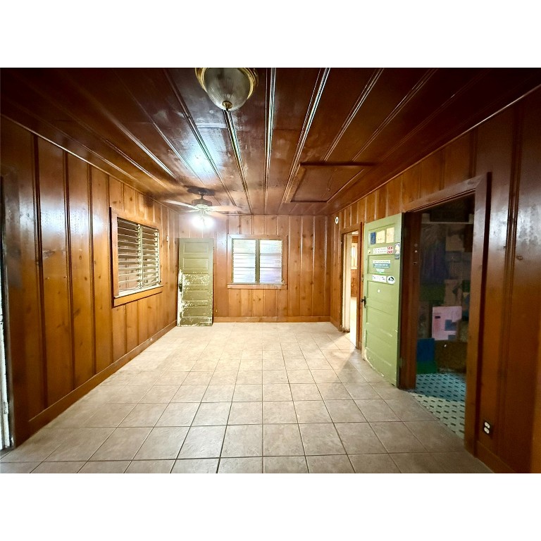 14456 Agarita Road Austin, TX 78734 - Photo 22 of 40 a picture of an empty room with wooden floor and windows