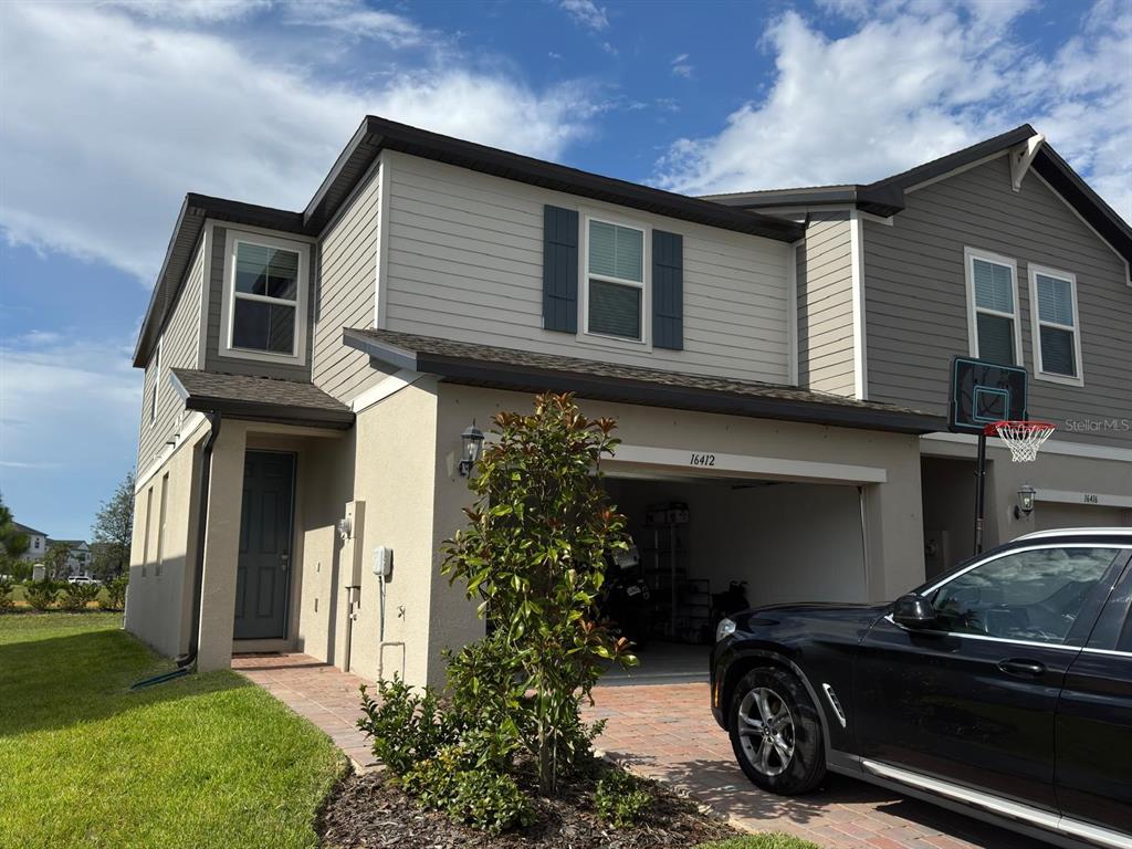 a car parked in front of a house