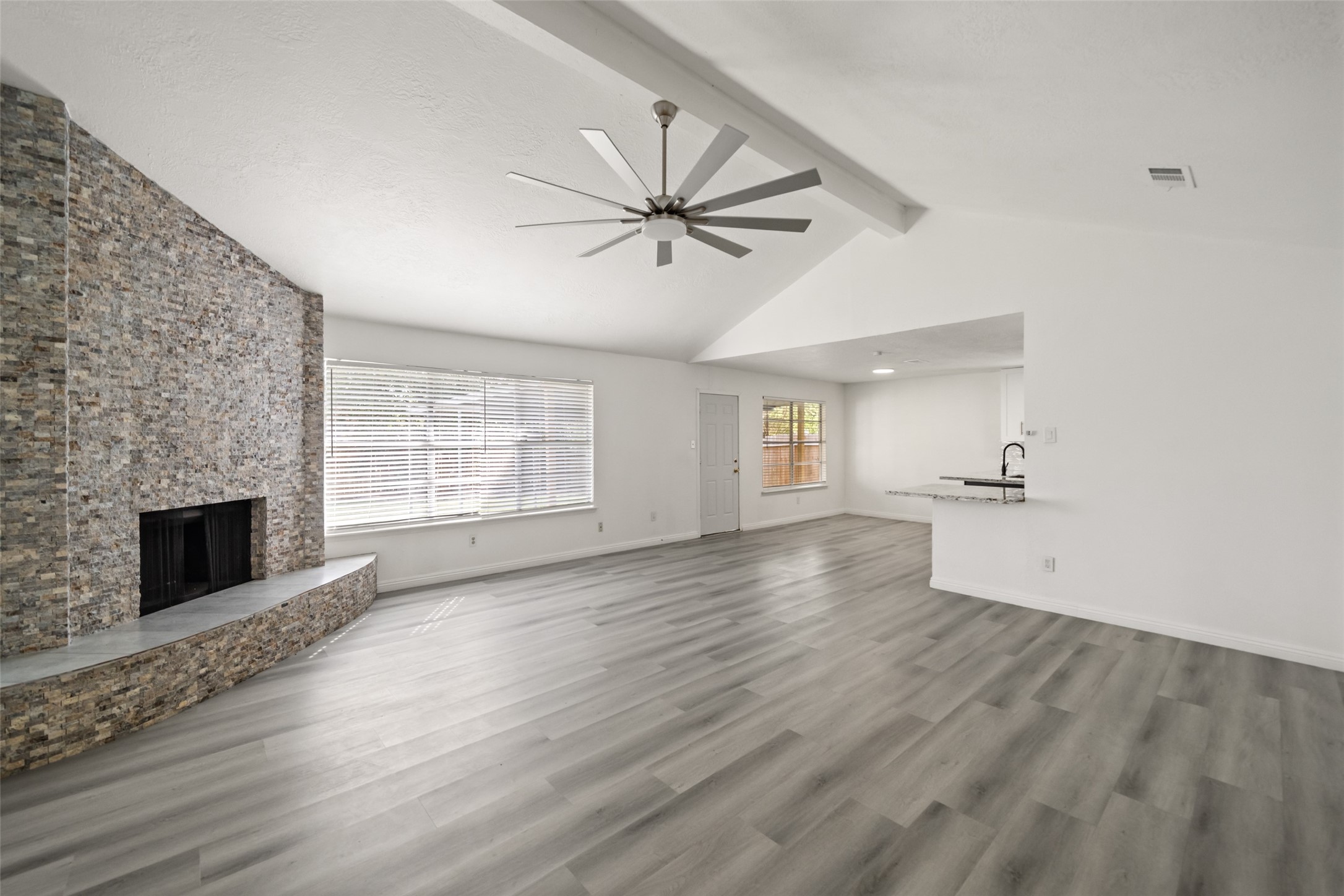 5726 Yorkgate Drive Spring, TX 77373 - Photo 1 of 20 wooden floor in an empty room with a fireplace