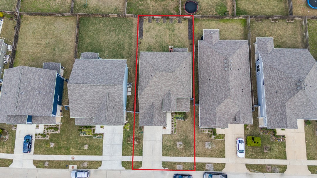 8327 Calico Pennant Way Fulshear, TX 77441 - Photo 40 of 44 aerial view of a house with a yard and large tree