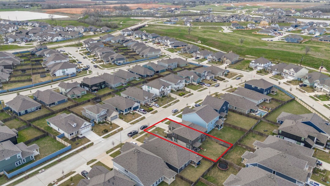 8327 Calico Pennant Way Fulshear, TX 77441 - Photo 41 of 44 a view of a city with a lake view