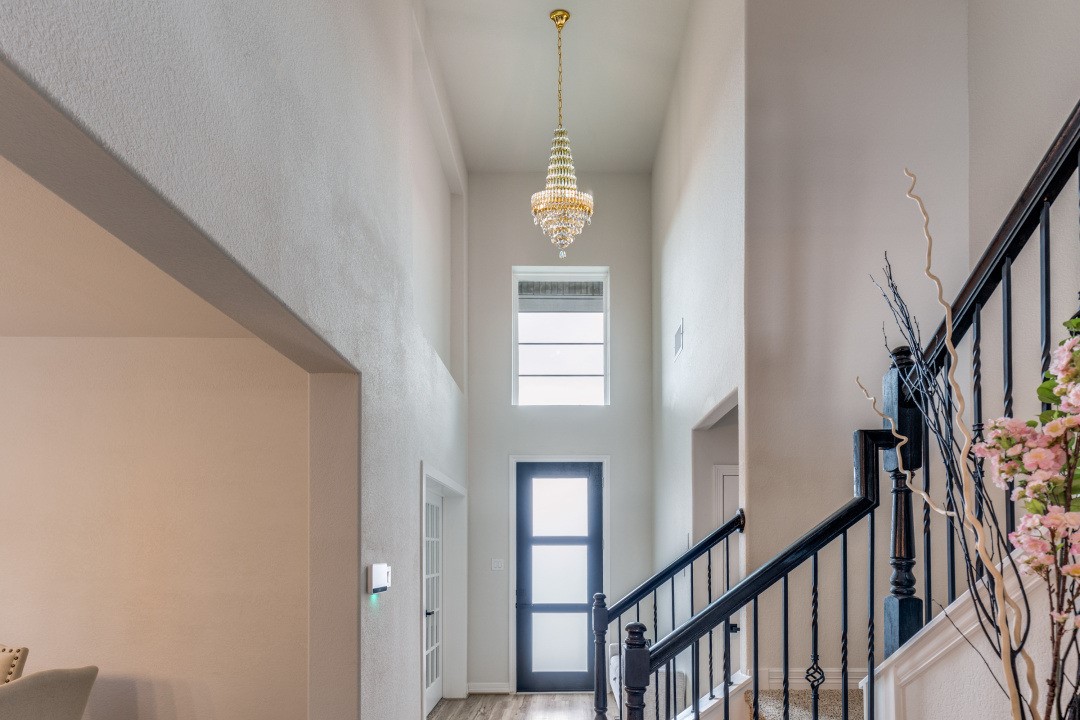 8327 Calico Pennant Way Fulshear, TX 77441 - Photo 6 of 44 a view of a hallway with windows