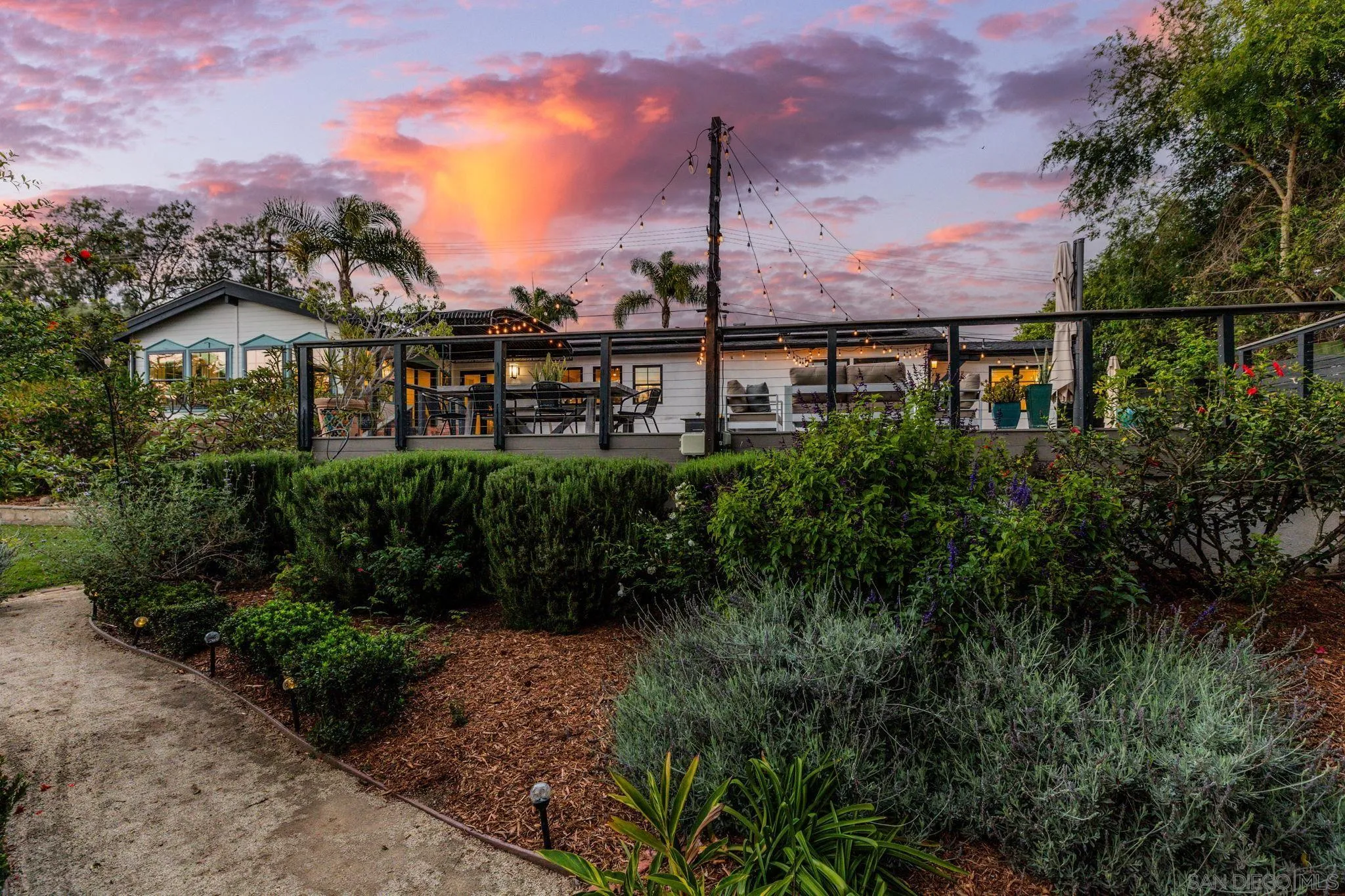 2335 Ivy Road Oceanside, CA 92054 - Photo 4 of 53 a view of a garden with a building in the background