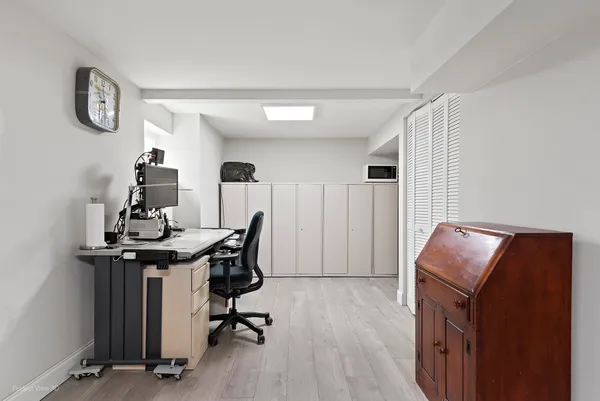 a view of workspace with wooden floor windows