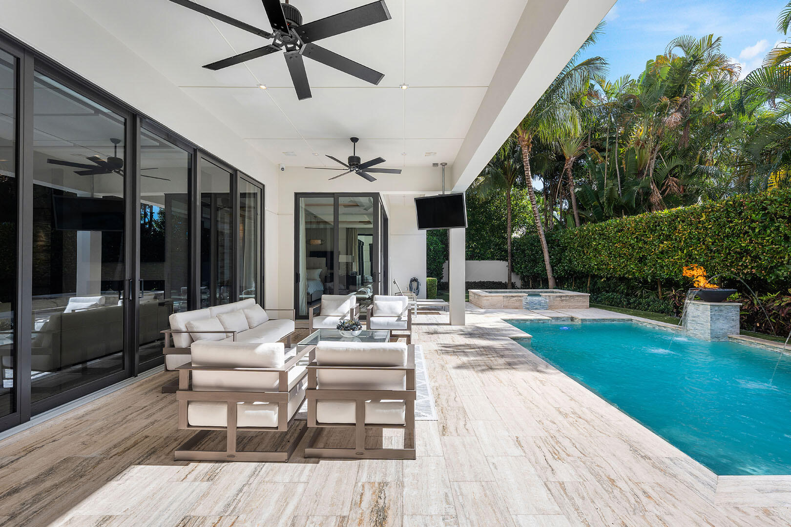 252 South Silver Palm Road Boca Raton, FL 33432 - Photo 27 of 90 a view of a patio with couches and table and chairs and potted plants