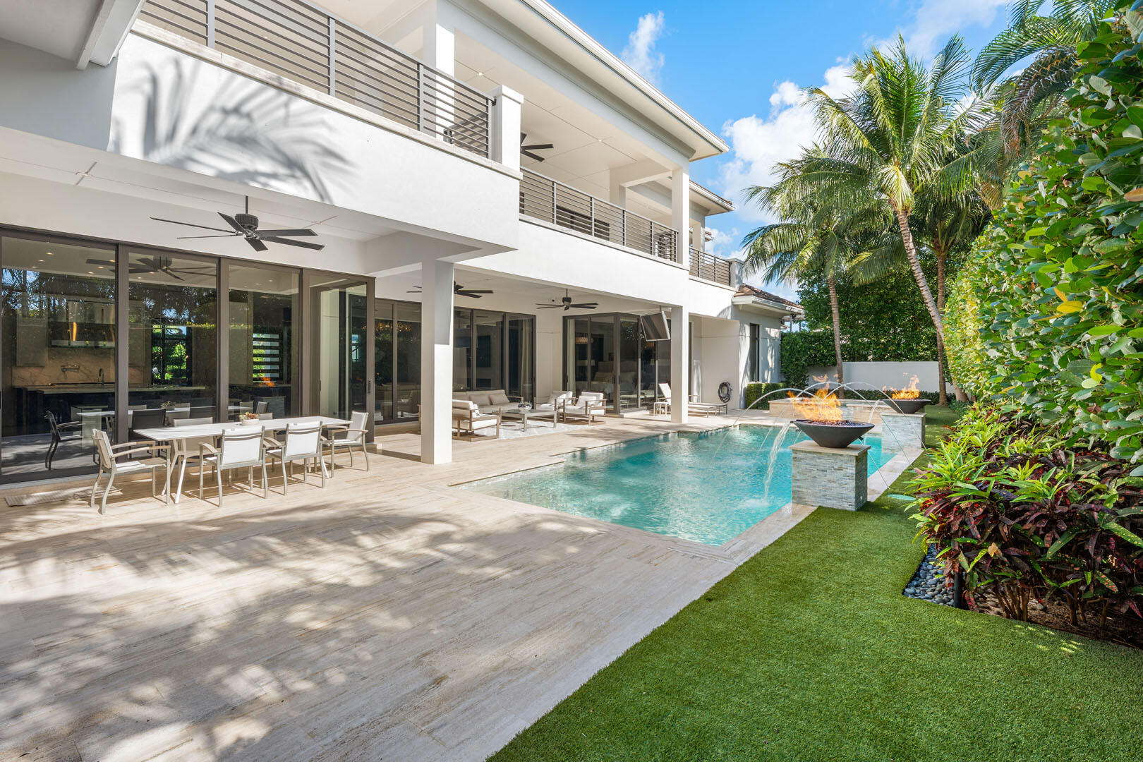 252 South Silver Palm Road Boca Raton, FL 33432 - Photo 31 of 90 a view of a patio with table and chairs potted plants and large tree
