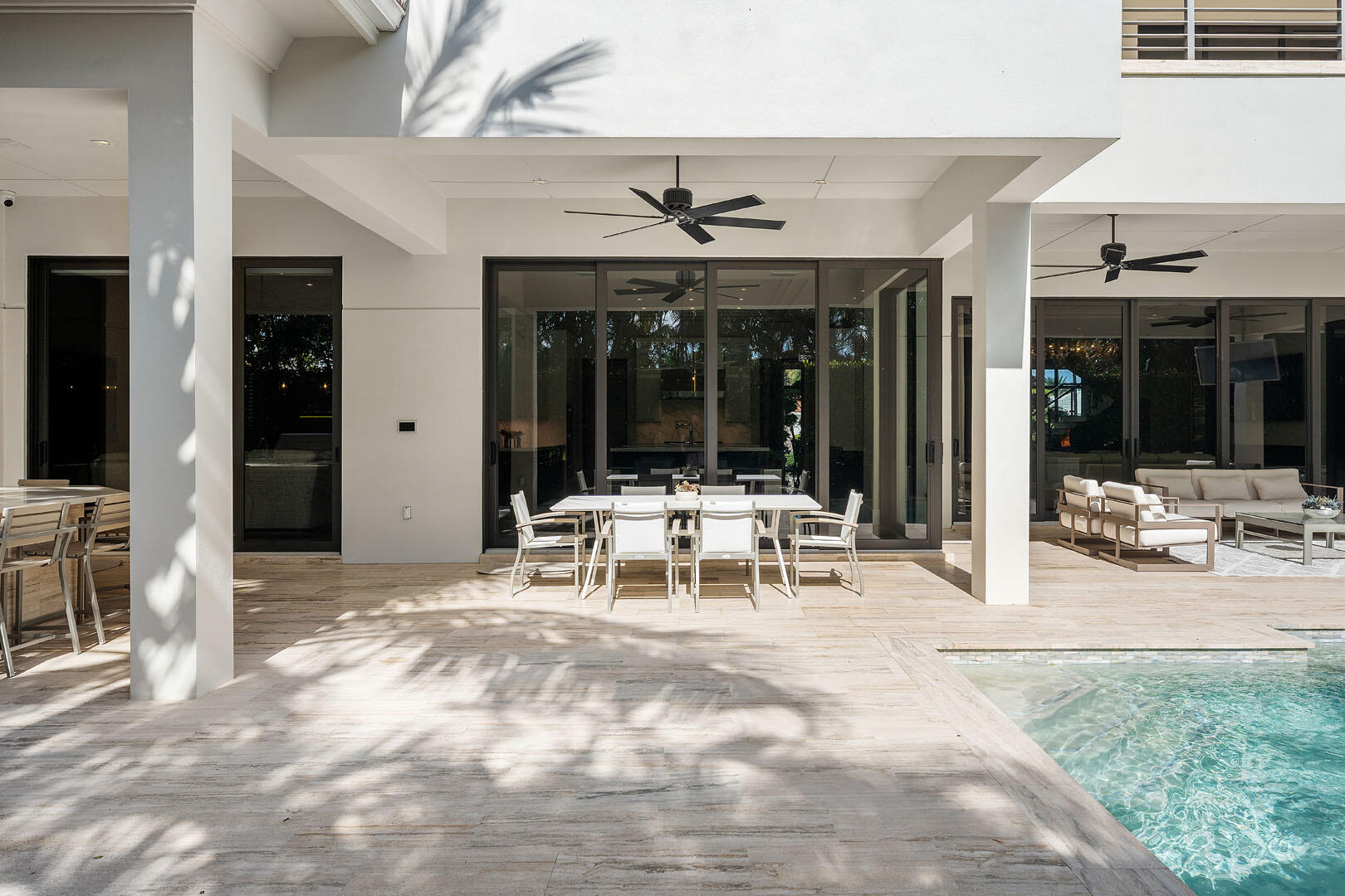 252 South Silver Palm Road Boca Raton, FL 33432 - Photo 33 of 90 a view of a patio with table and chairs and potted plants