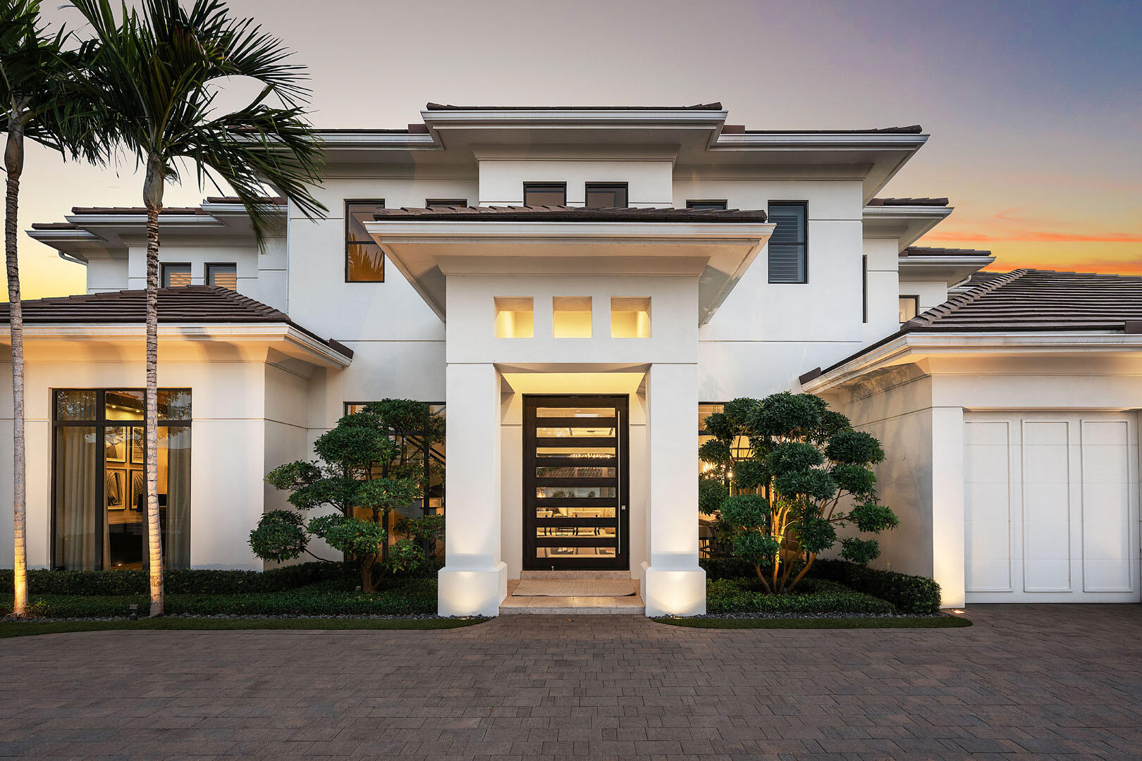 252 South Silver Palm Road Boca Raton, FL 33432 - Photo 71 of 90 front view of a house with a potted plants and a gate
