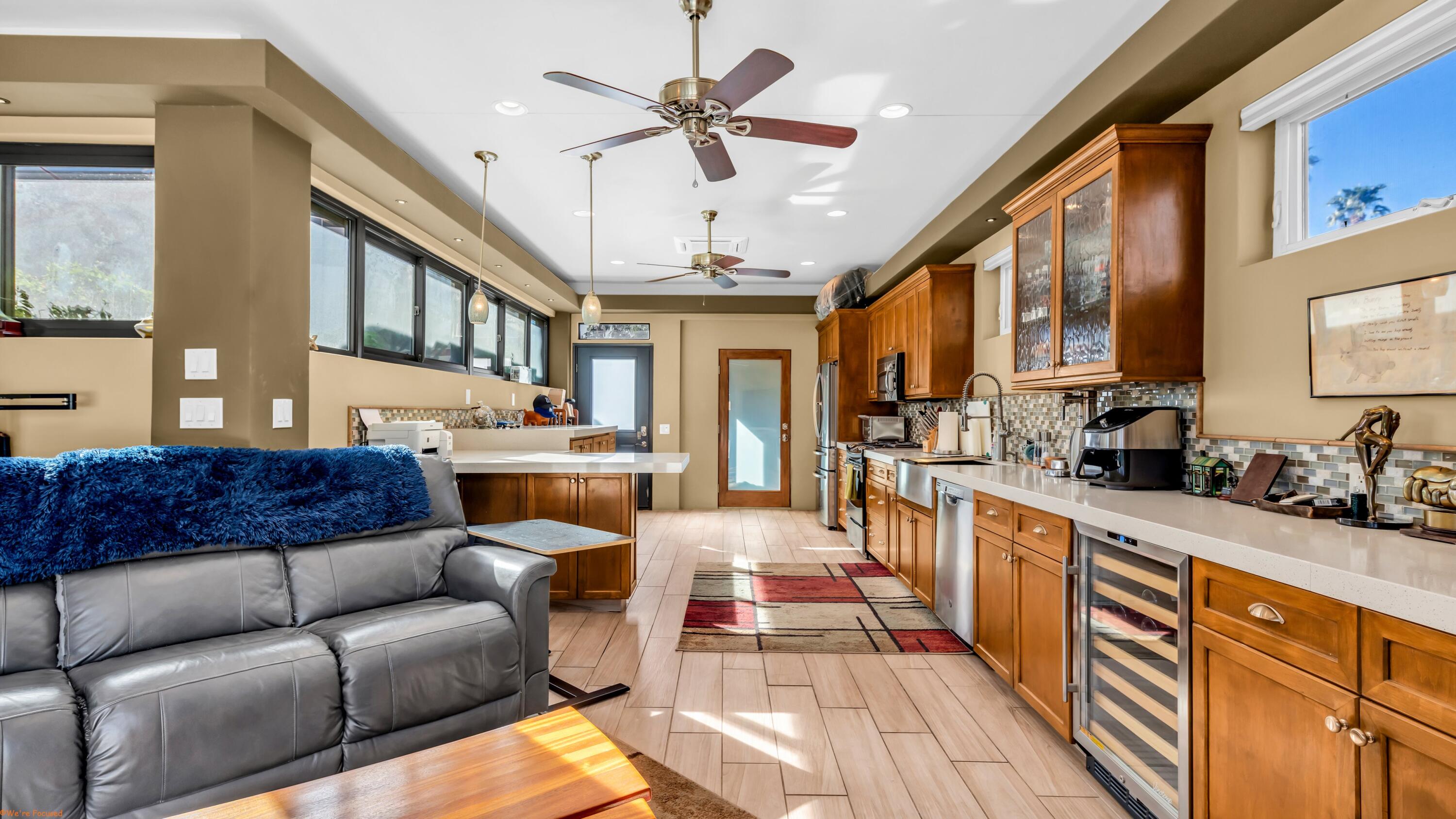 80501 Ave 48, Unit 22 Indio, CA 92201 - Photo 11 of 26 a living room with stainless steel appliances granite countertop furniture a couch and a chandelier
