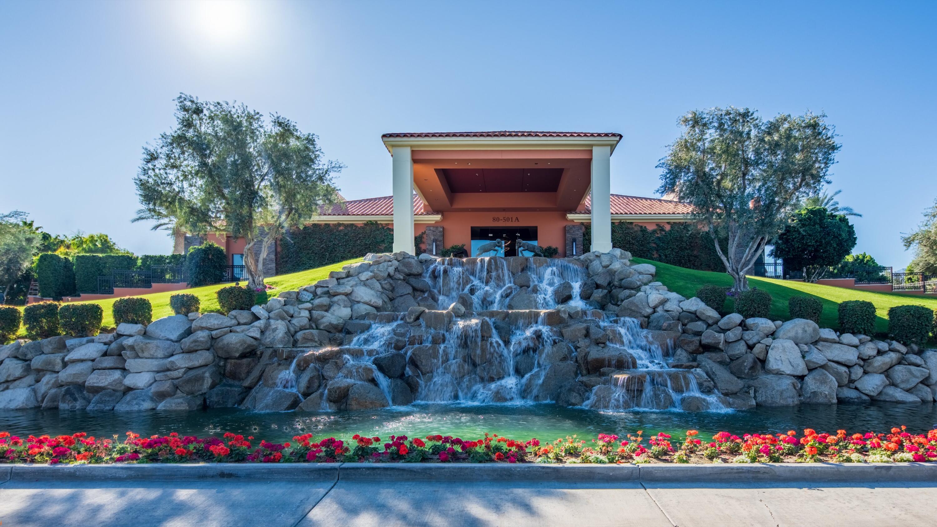 80501 Ave 48, Unit 22 Indio, CA 92201 - Photo 19 of 26 a front view of a house with a yard