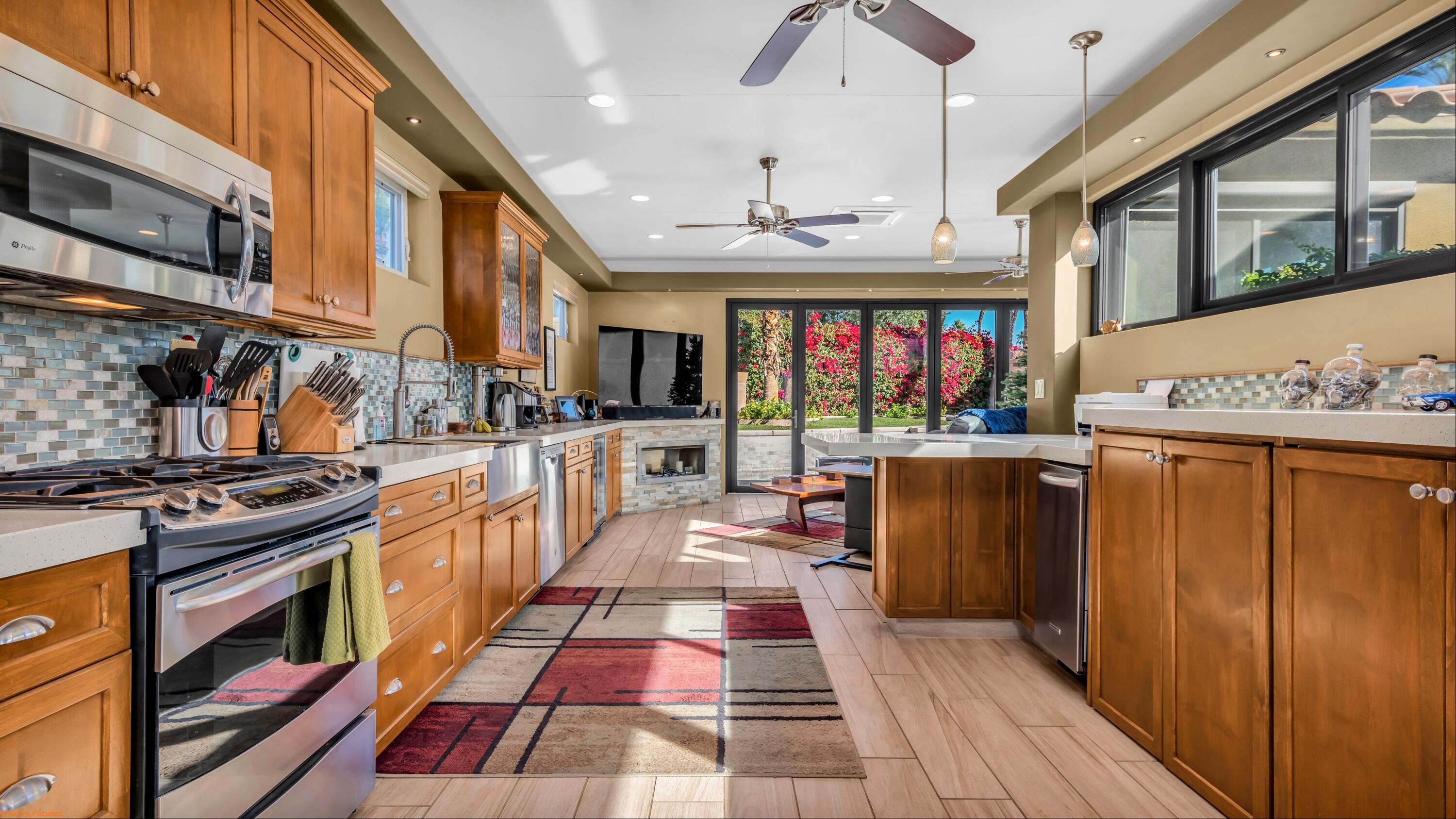 80501 Ave 48, Unit 22 Indio, CA 92201 - Photo 3 of 26 a kitchen with stainless steel appliances granite countertop a stove and cabinets