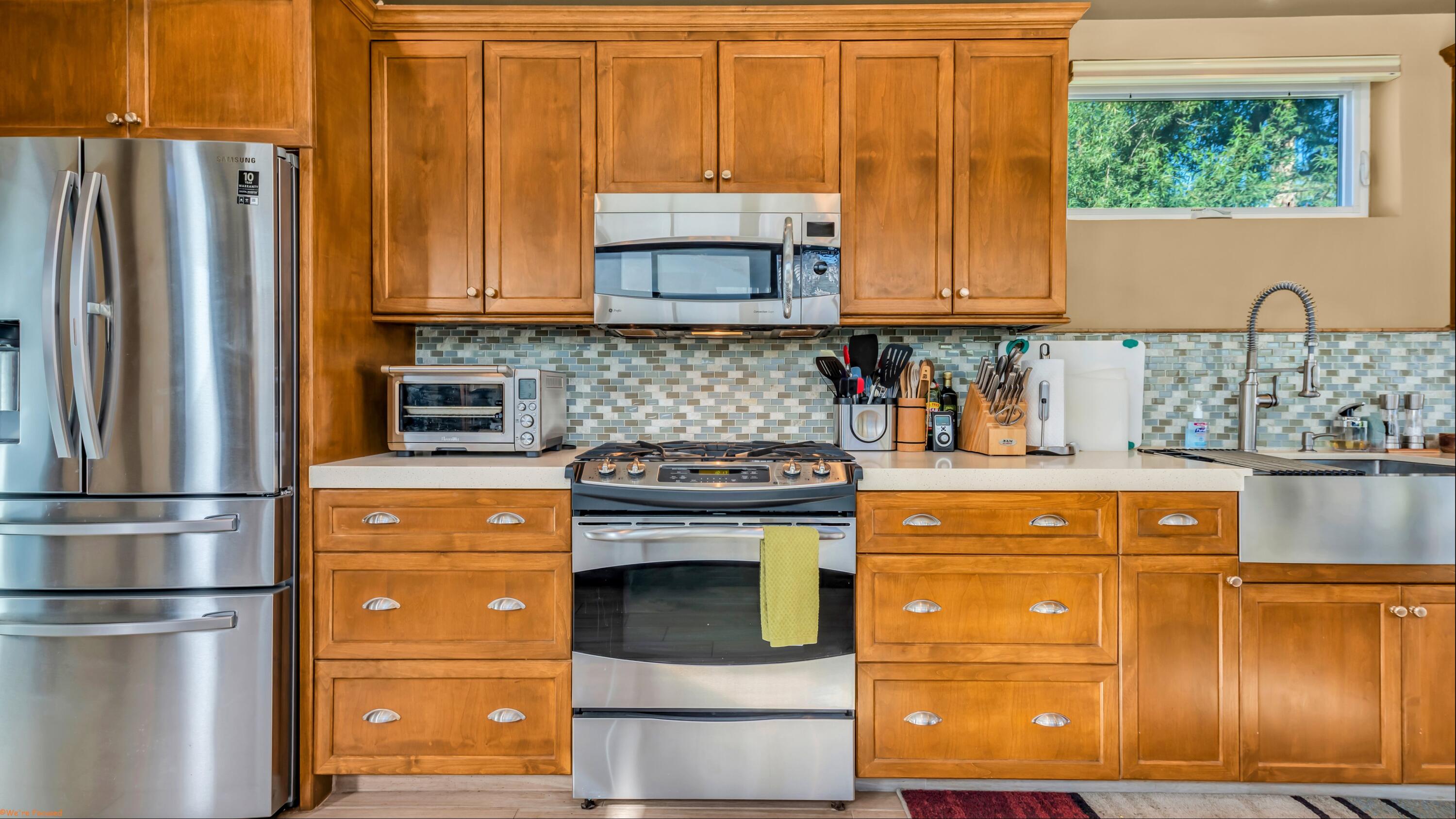80501 Ave 48, Unit 22 Indio, CA 92201 - Photo 4 of 26 a kitchen with stainless steel appliances granite countertop a refrigerator stove and sink
