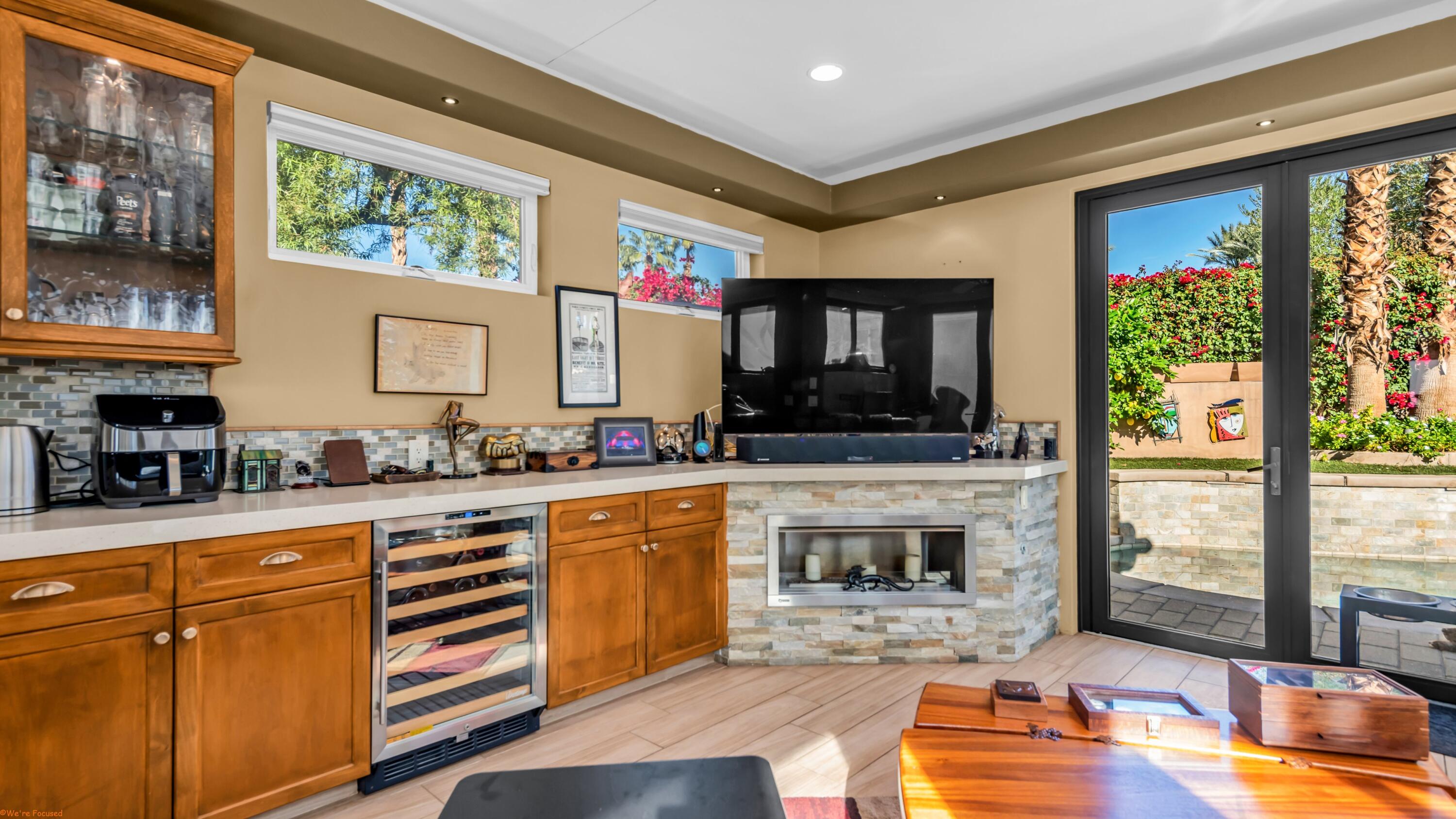 80501 Ave 48, Unit 22 Indio, CA 92201 - Photo 9 of 26 a kitchen with stainless steel appliances granite countertop a stove a sink and a microwave