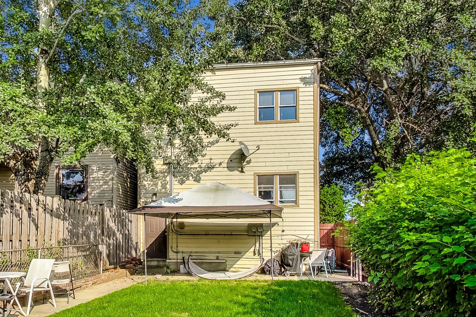 2700 North Artesian Avenue, Unit 1 Chicago, IL 60647 - Photo 11 of 11 a view of a house with a yard