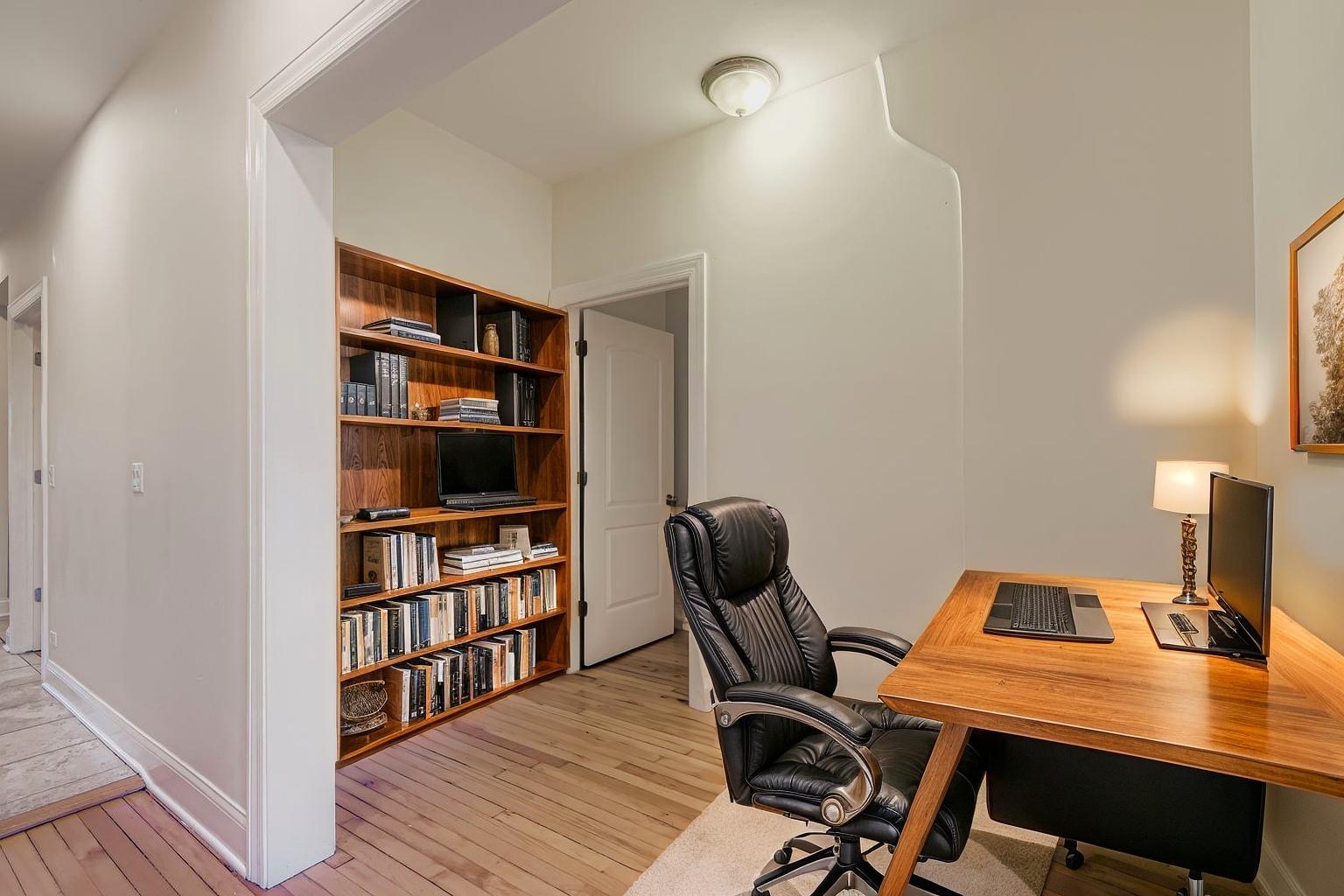 2700 North Artesian Avenue, Unit 1 Chicago, IL 60647 - Photo 3 of 11 a view of a workspace with furniture and wooden floor