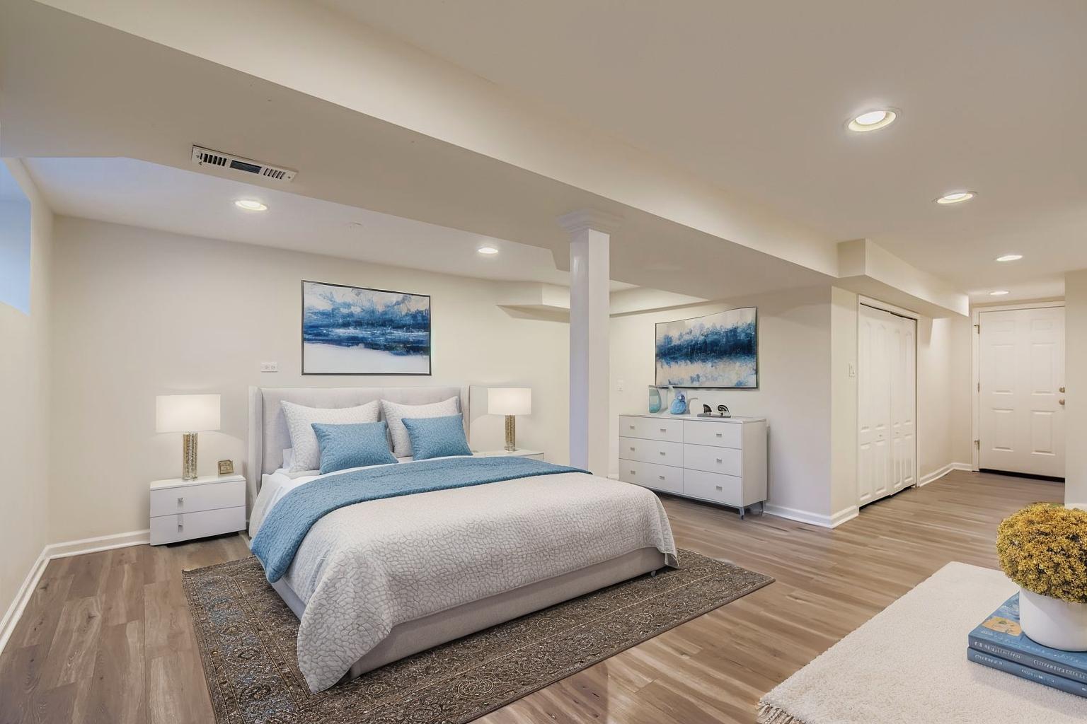 2700 North Artesian Avenue, Unit 1 Chicago, IL 60647 - Photo 8 of 11 a bedroom with a large bed and a couch