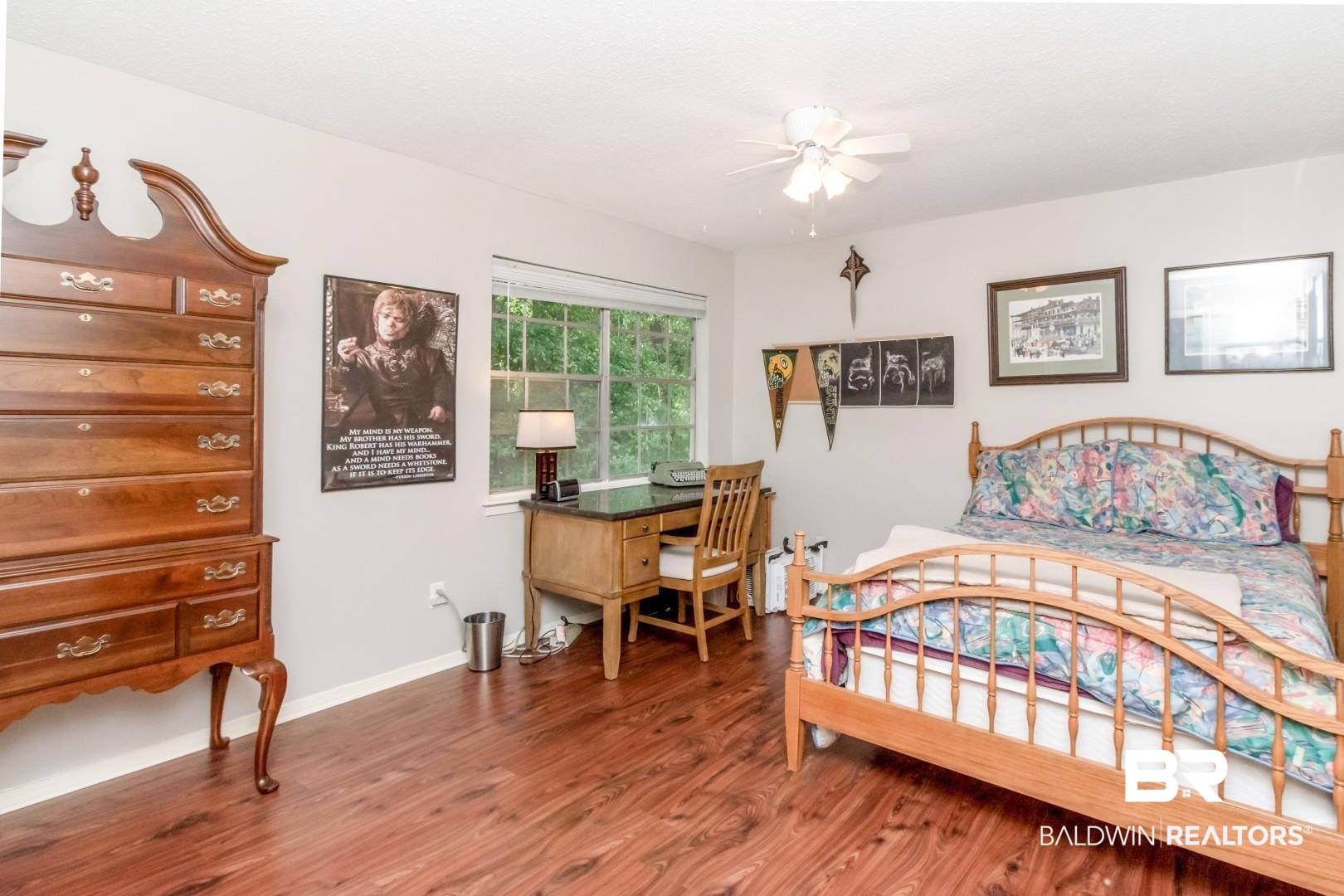 118 Du Rhu Drive, Unit H Mobile, AL 36608 - Photo 15 of 19 Bedroom with wood-finish flooring, a ceiling fan with light fixture, and a large window providing natural illumination