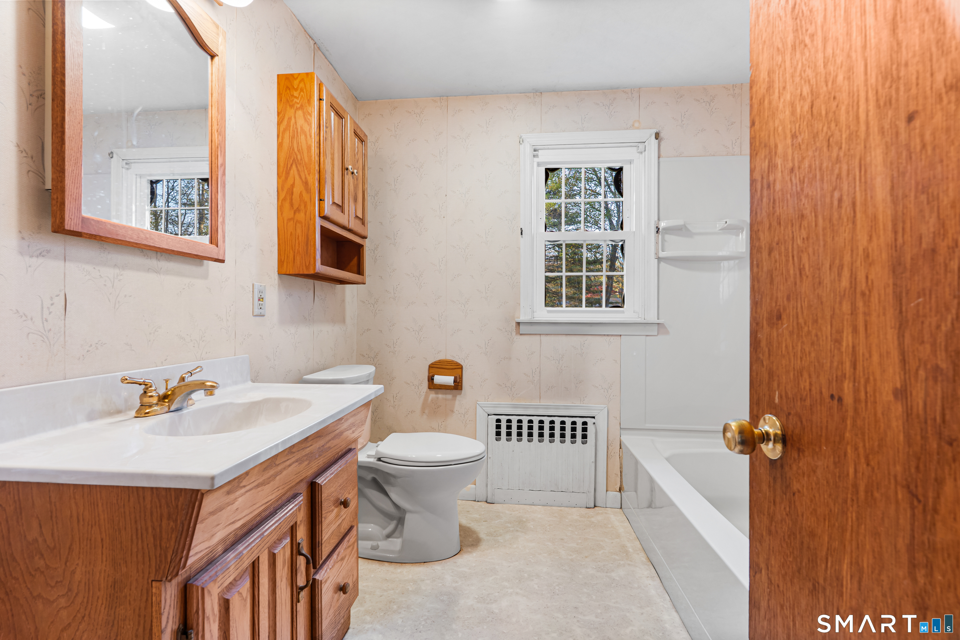 27 Valley Road Shelton, CT 06484 - Photo 13 of 32 a bathroom with a sink and a toilet