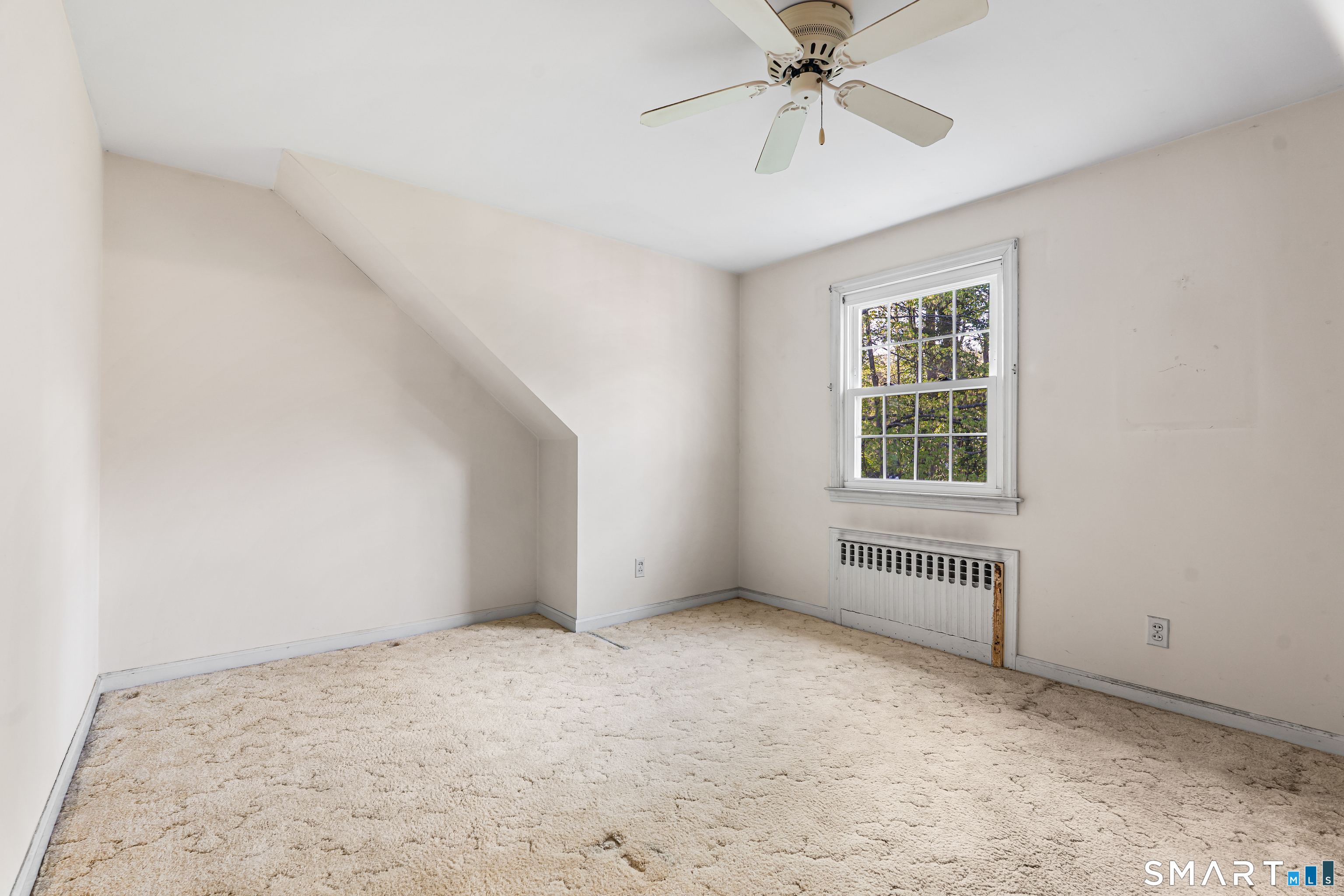 27 Valley Road Shelton, CT 06484 - Photo 16 of 32 an empty room with windows and fan