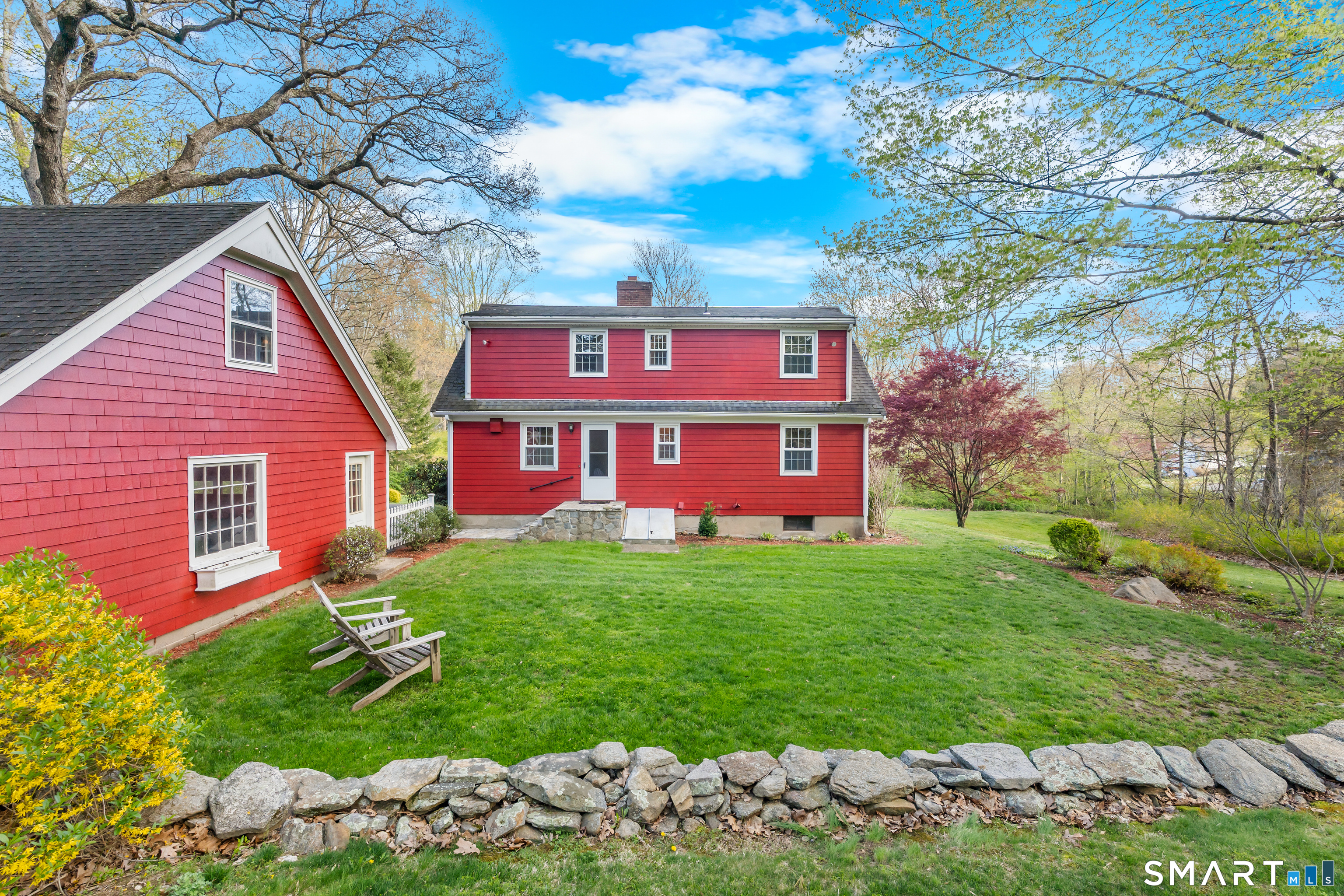 27 Valley Road Shelton, CT 06484 - Photo 20 of 32 a view of a brick house with a yard