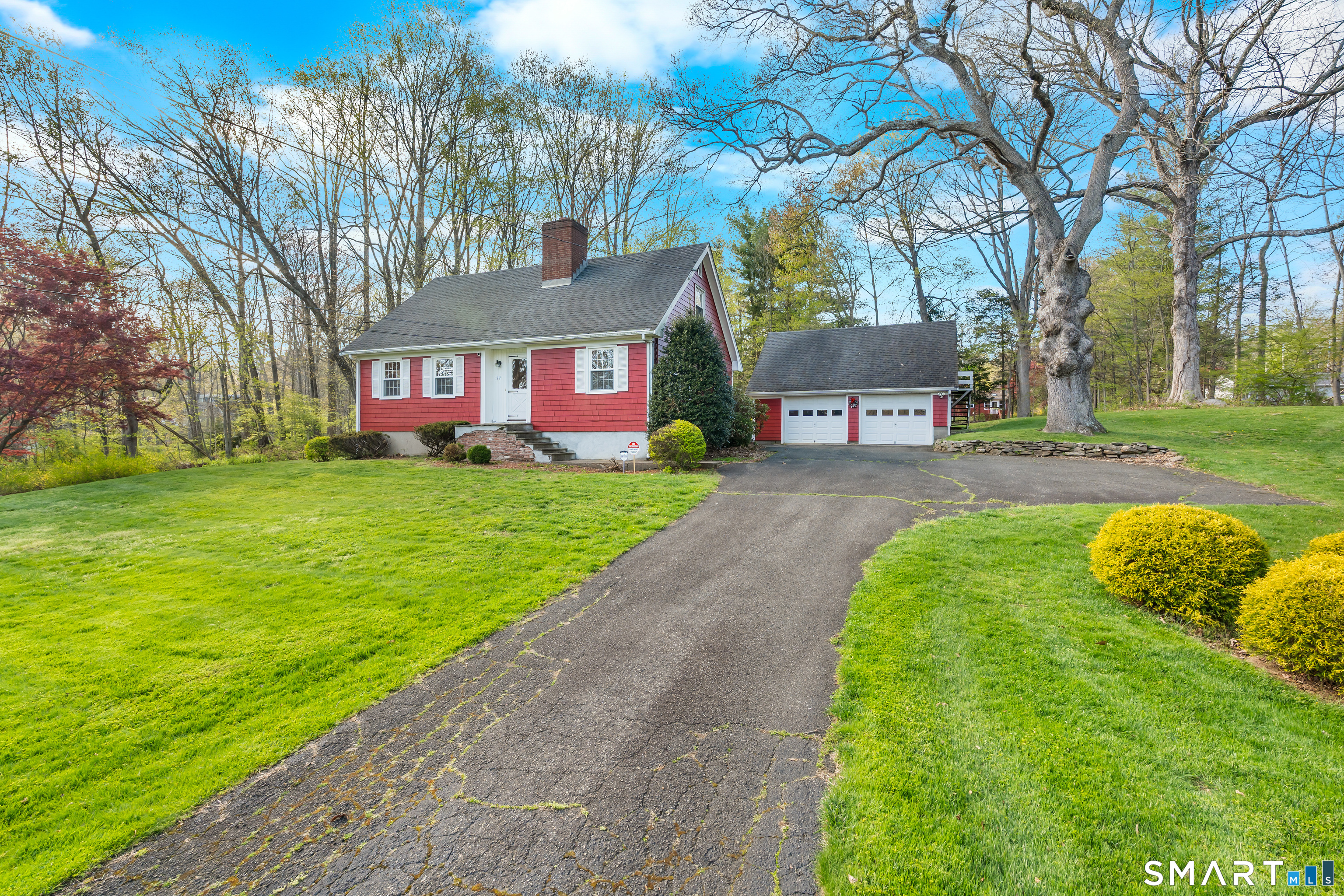 27 Valley Road Shelton, CT 06484 - Photo 4 of 32 a front view of a house with garden