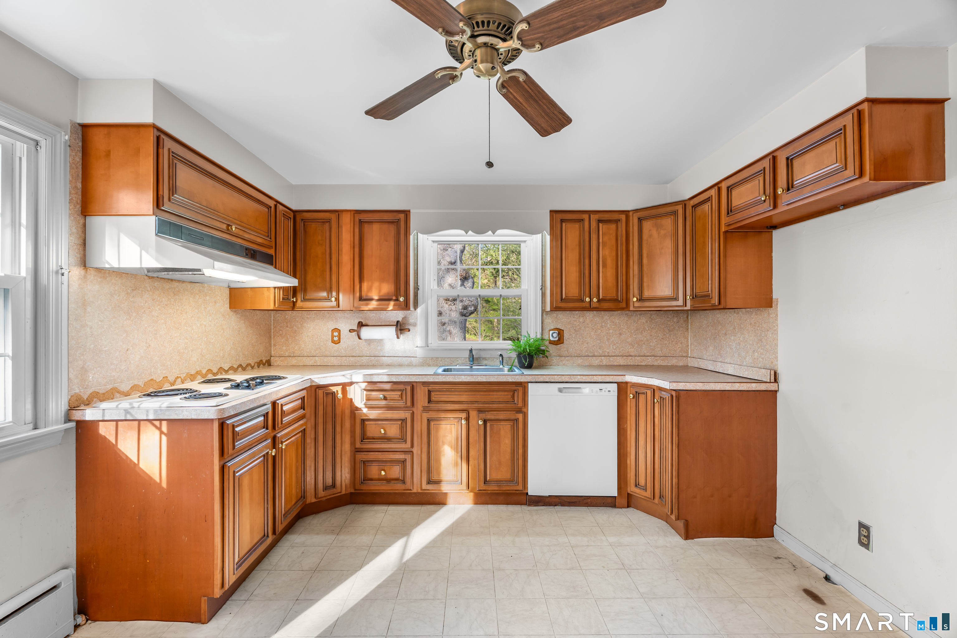 27 Valley Road Shelton, CT 06484 - Photo 7 of 32 a kitchen with stainless steel appliances granite countertop a stove a sink and a refrigerator