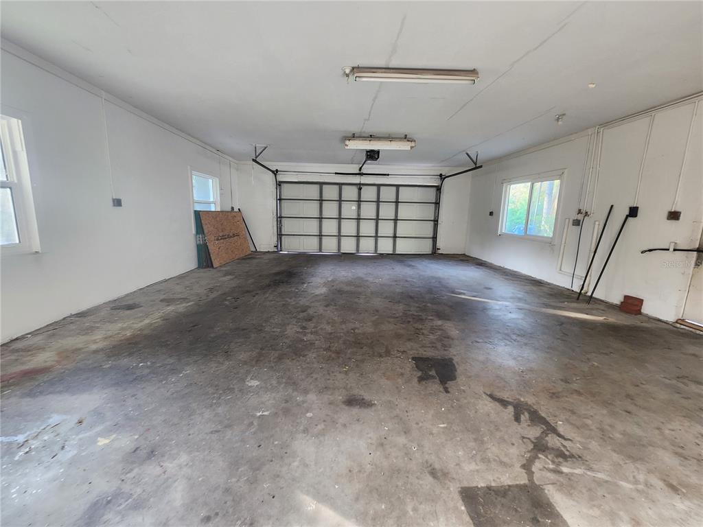 820 Crenshaw Lake Road Lutz, FL 33548 - Photo 17 of 48 a view of livingroom with hardwood floor and a ceiling fan