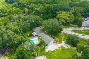 820 Crenshaw Lake Road Lutz, FL 33548 - Photo 2 of 48 an aerial view of a house with a yard