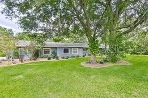 a kitchen with stainless steel appliances a refrigerator and a stove top oven