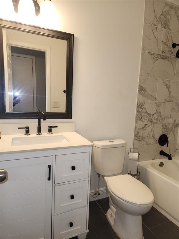 820 Crenshaw Lake Road Lutz, FL 33548 - Photo 33 of 48 a bathroom with a sink and a toilet