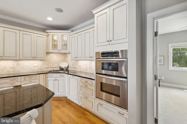 a view of a porch with furniture and floor to ceiling window