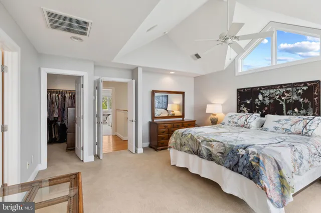 a bedroom with a bed and a table