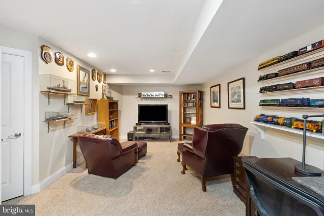 an aerial view of residential houses with outdoor space and swimming pool