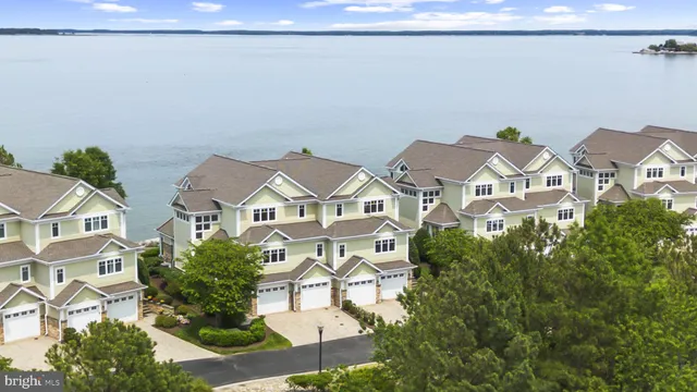 a view of a brick house with a yard