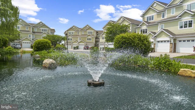 a view of a lake with a bench next to a lake