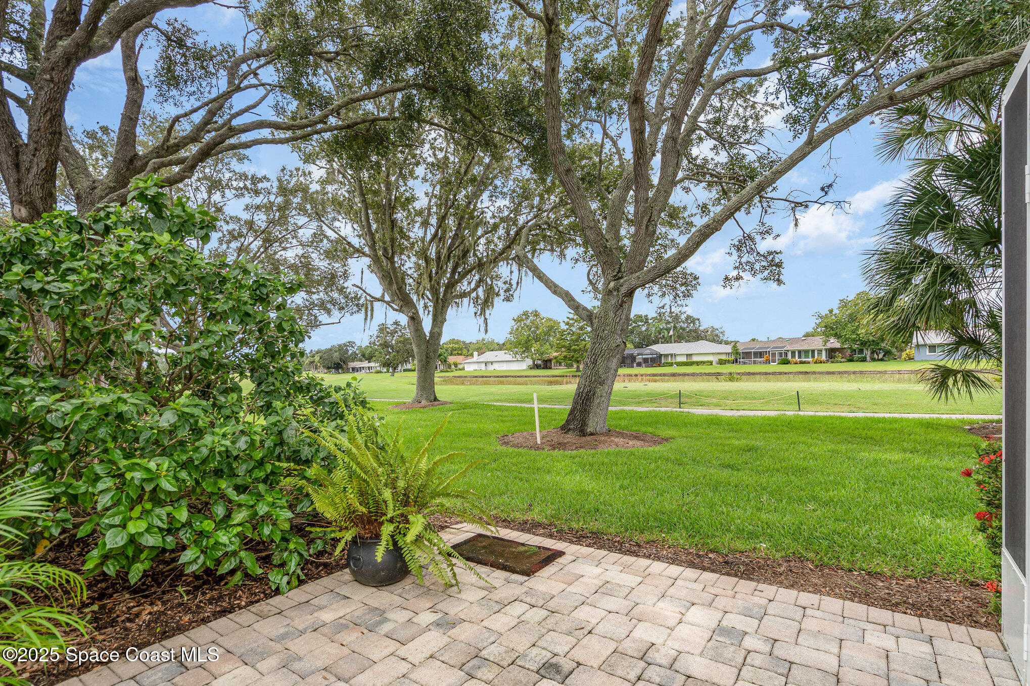 1372 Independence Avenue Melbourne, FL 32940 - Photo 22 of 38 Open back paver patio