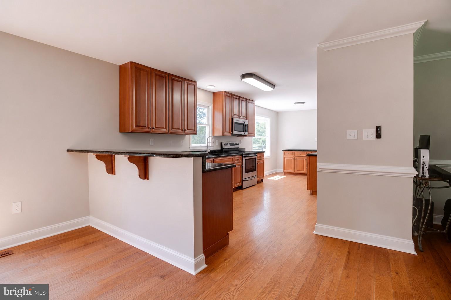 10461 Old Stillhouse Road Boston, VA 22713 - Photo 8 of 63 Modern kitchen with warm wood accents.