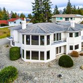 a aerial view of a house with a yard and sitting area