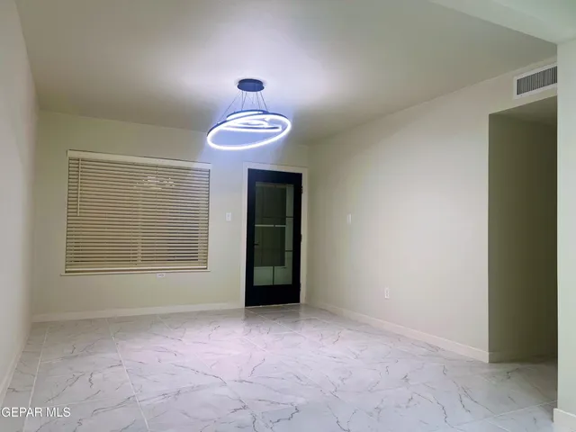a kitchen with white cabinets
