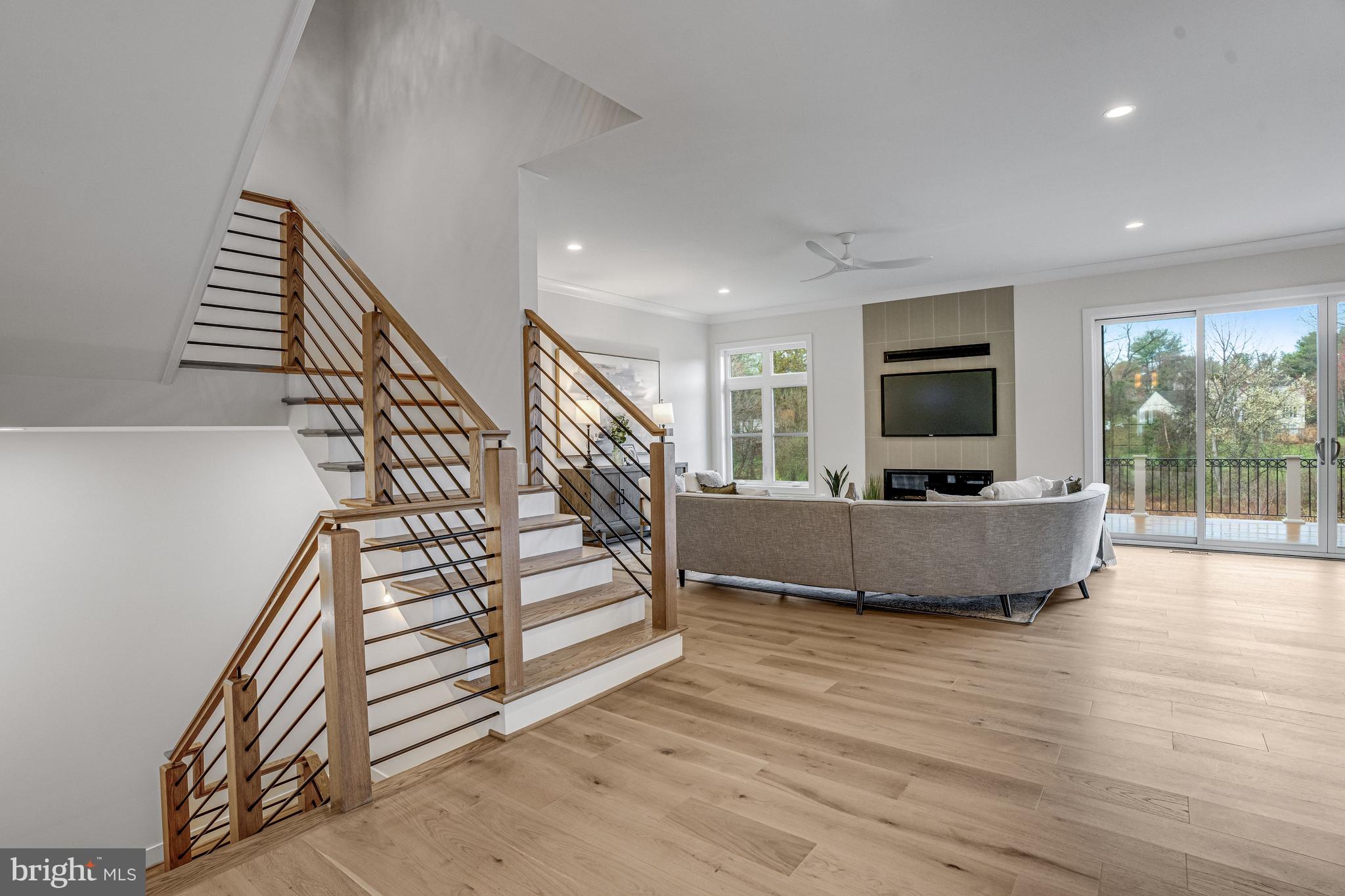 1002 Springvale Road Great Falls, VA 22066 - Photo 17 of 114 a living room with furniture and a flat screen tv